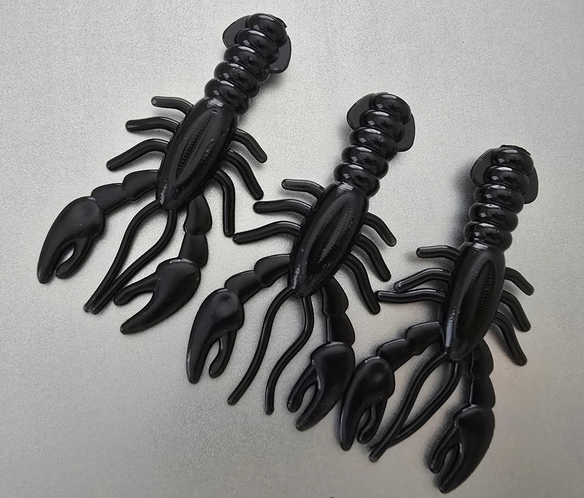 Sapper Baits Blackout 3.4-inch Breacher Craw soft plastic craw bait in solid black, designed for bass fishing, flipping, pitching, and Texas rig presentations.