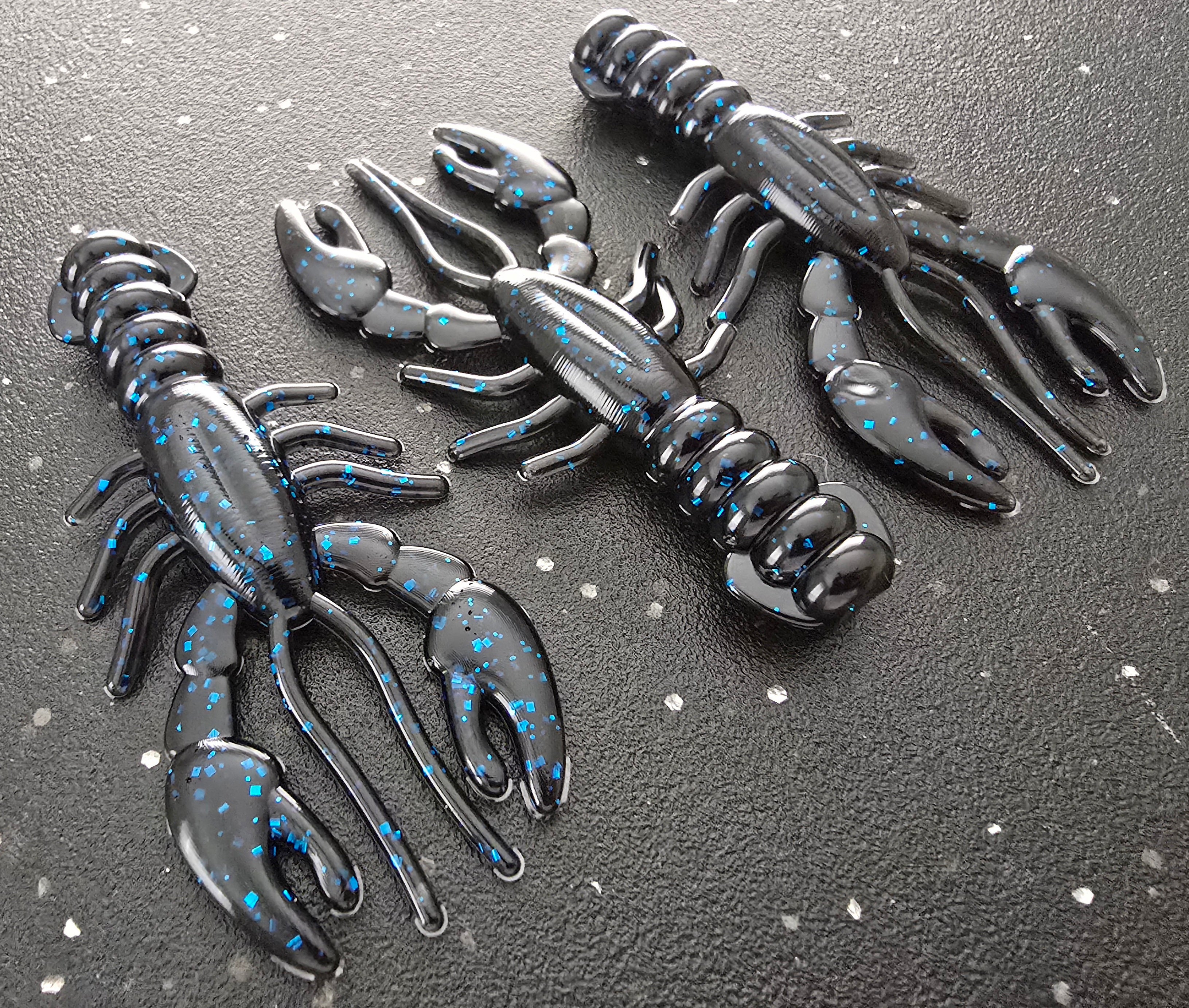 Three sapper baits breacher craw in black with Blue Flake