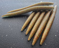 Sapper Stick Bait In Color Kiwi Gold Pearl with Black, Red, Gold Flake